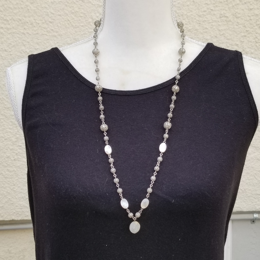 silver tone filigree ball necklace with white iridescent flat beads
